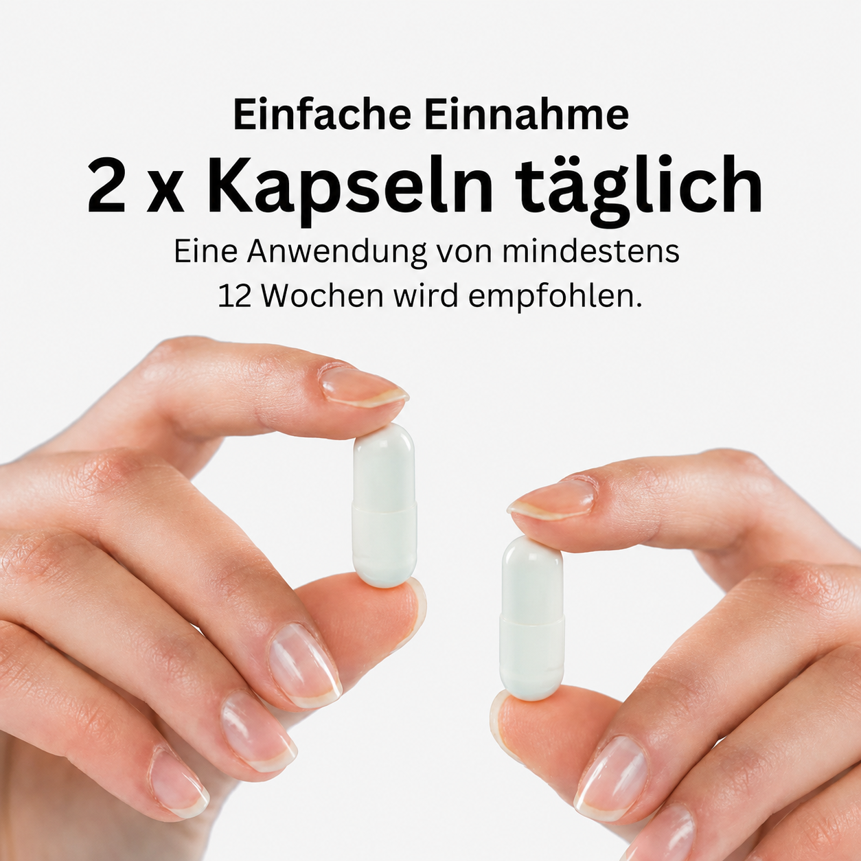 Zwei Kapseln Leonexin Komplex werden zwischen den Fingern gehalten
